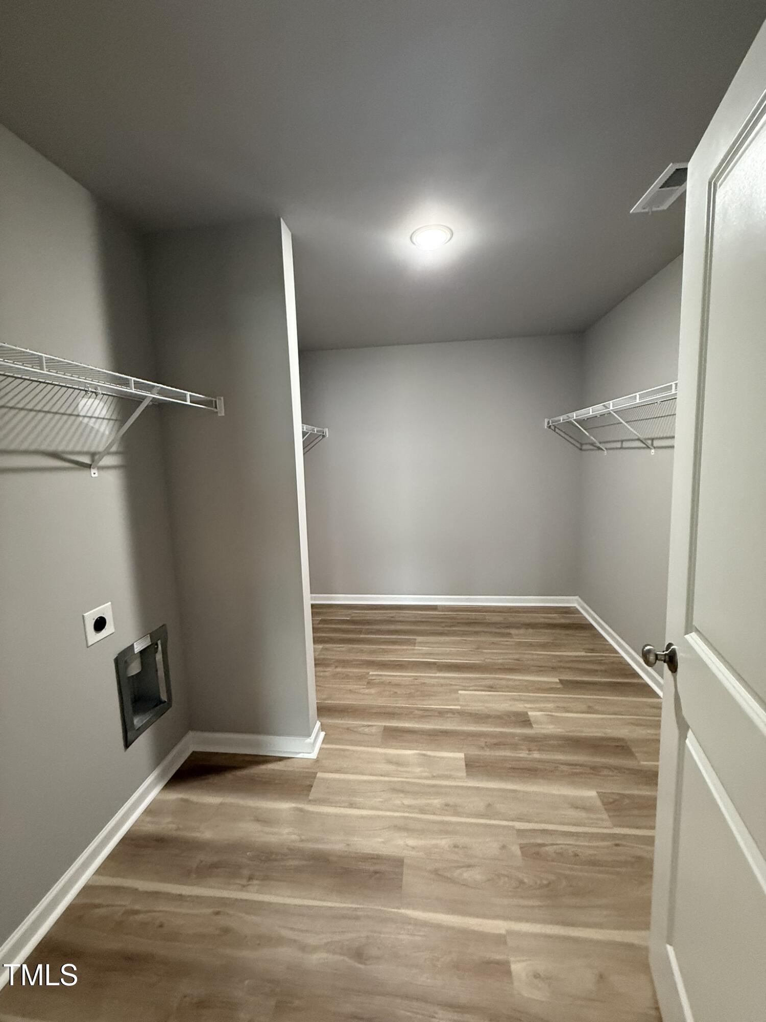 146 Starry Sky Drive Benson, NC 27504 - Photo 11 of 16 a view of a room with wooden floor and utility room