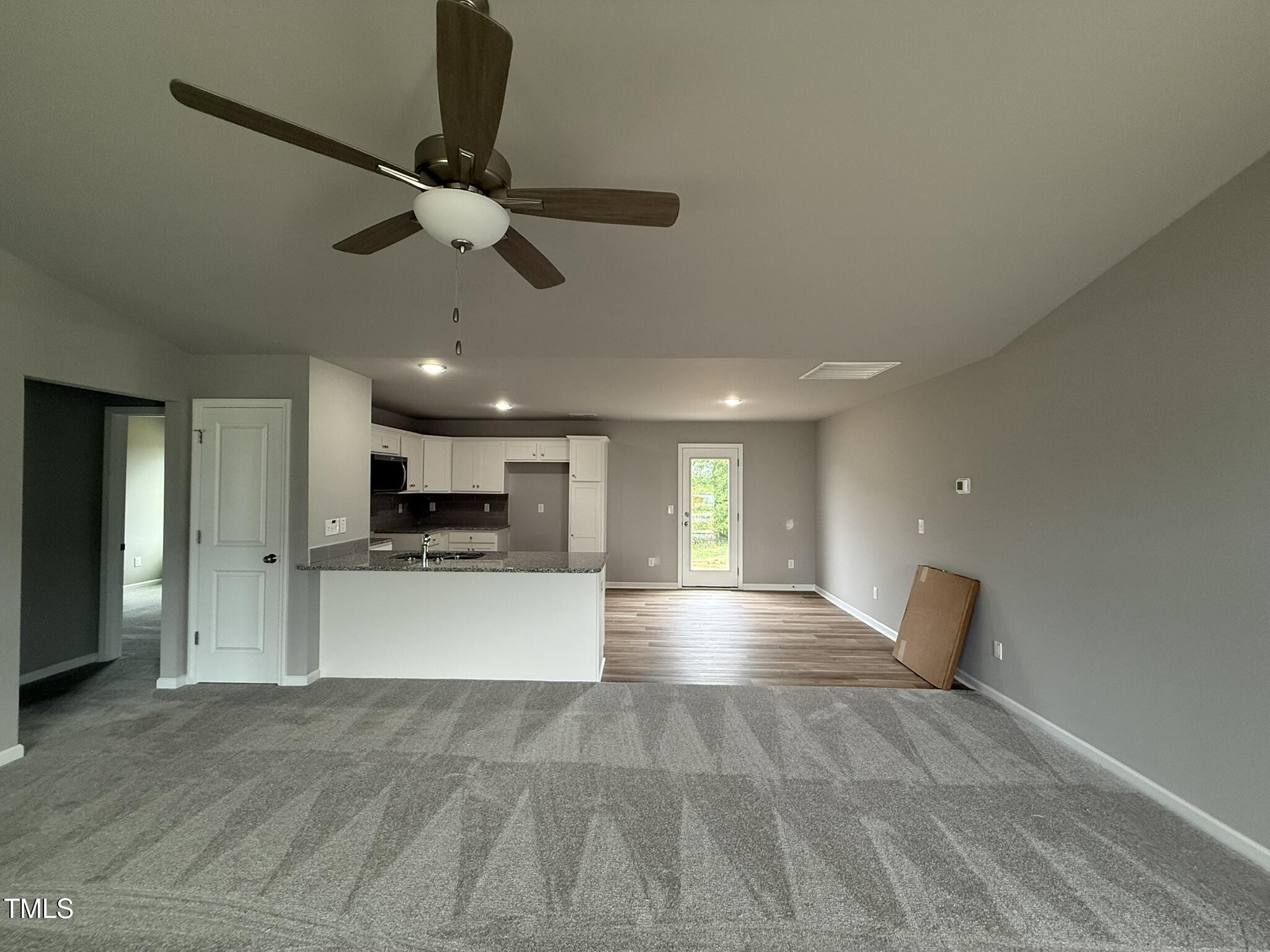 146 Starry Sky Drive Benson, NC 27504 - Photo 6 of 16 a view of kitchen with refrigerator microwave and stove