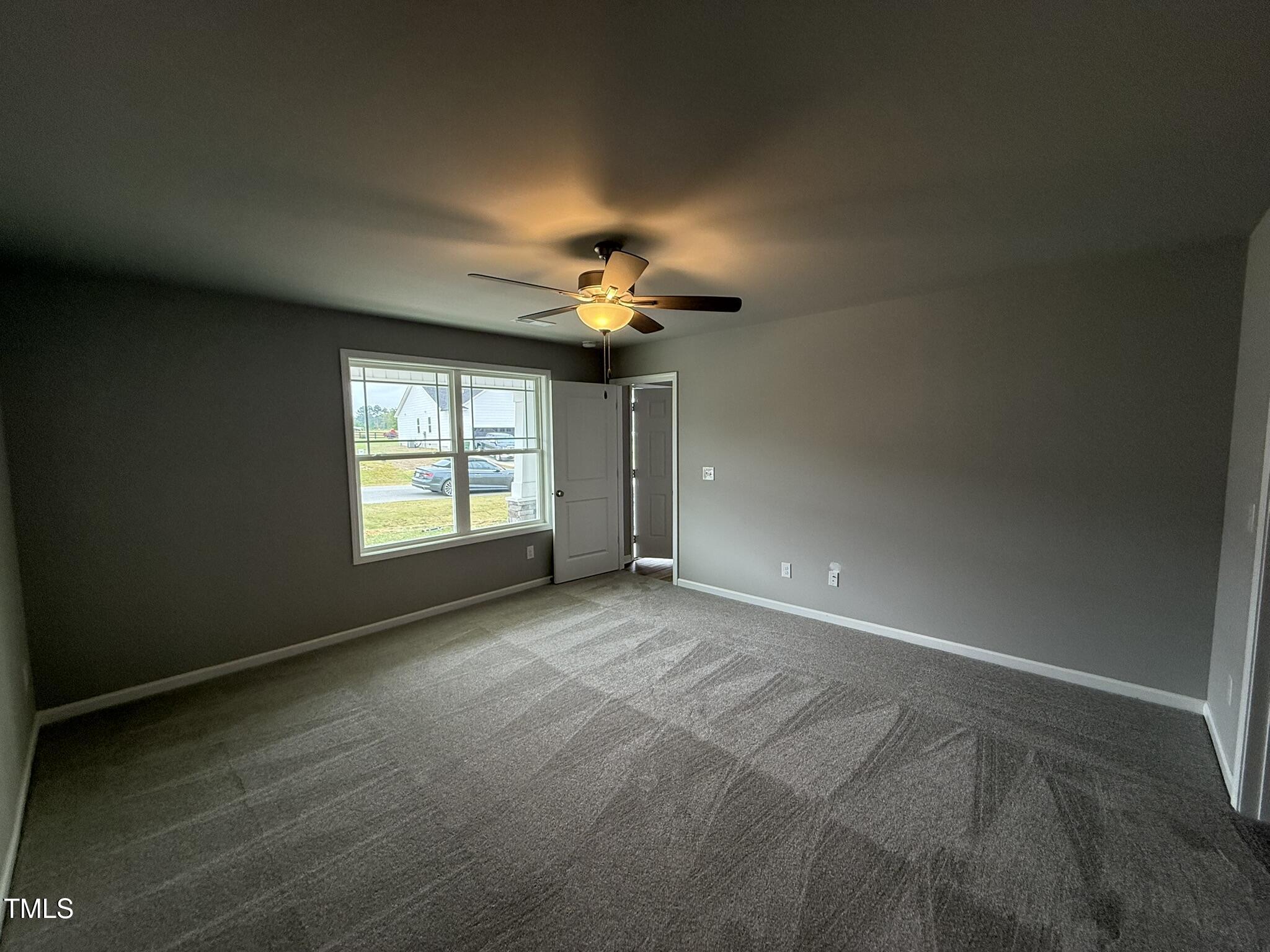 146 Starry Sky Drive Benson, NC 27504 - Photo 9 of 16 a view of n empty room with a window