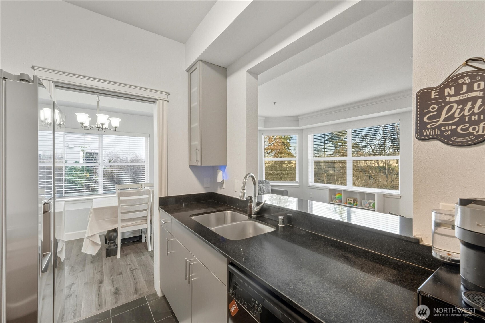 255 West Bakerview Road, Unit B103 Bellingham, WA 98226 - Photo 9 of 40 a kitchen with a sink and a large window
