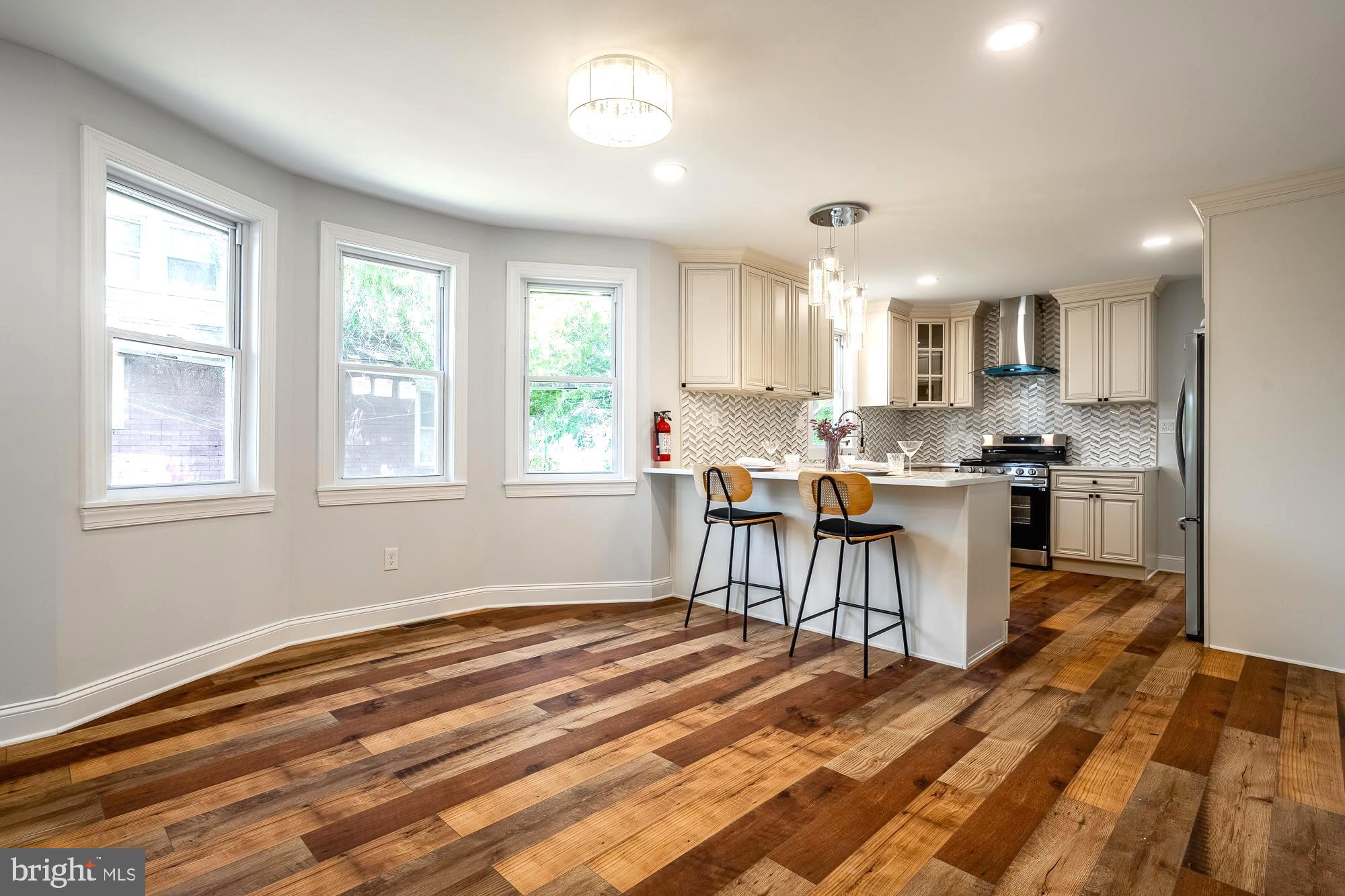 27 Cherry Avenue Maple Shade, NJ 08052 - Photo 10 of 50 a kitchen with a table chairs a sink and dishwasher