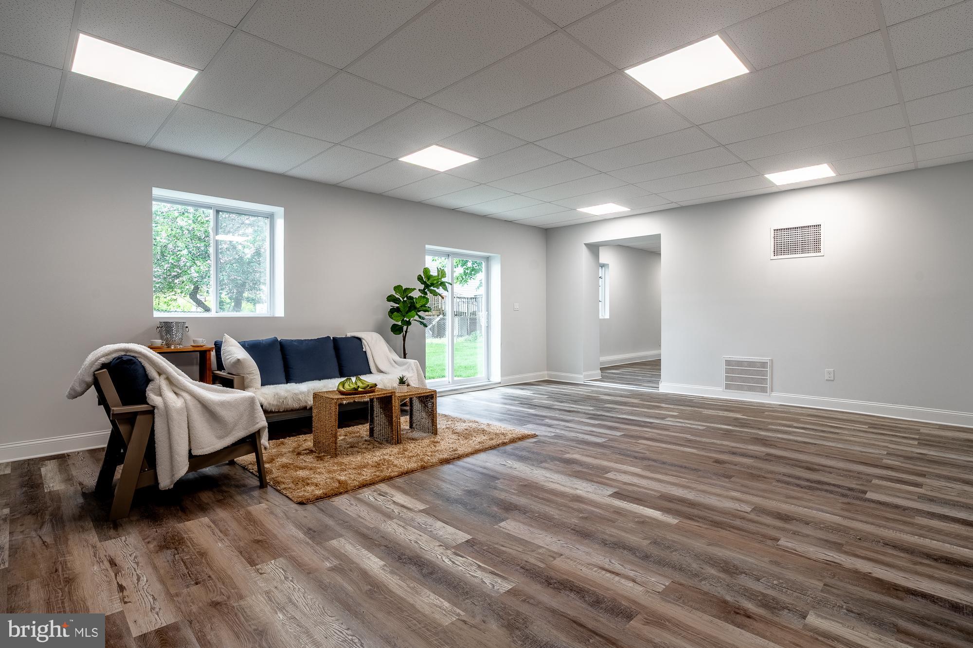 27 Cherry Avenue Maple Shade, NJ 08052 - Photo 38 of 50 a living room with furniture and a wooden floor