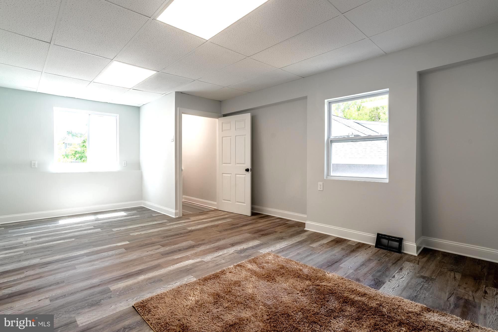 27 Cherry Avenue Maple Shade, NJ 08052 - Photo 42 of 50 a view of an empty room with wooden floor and a window