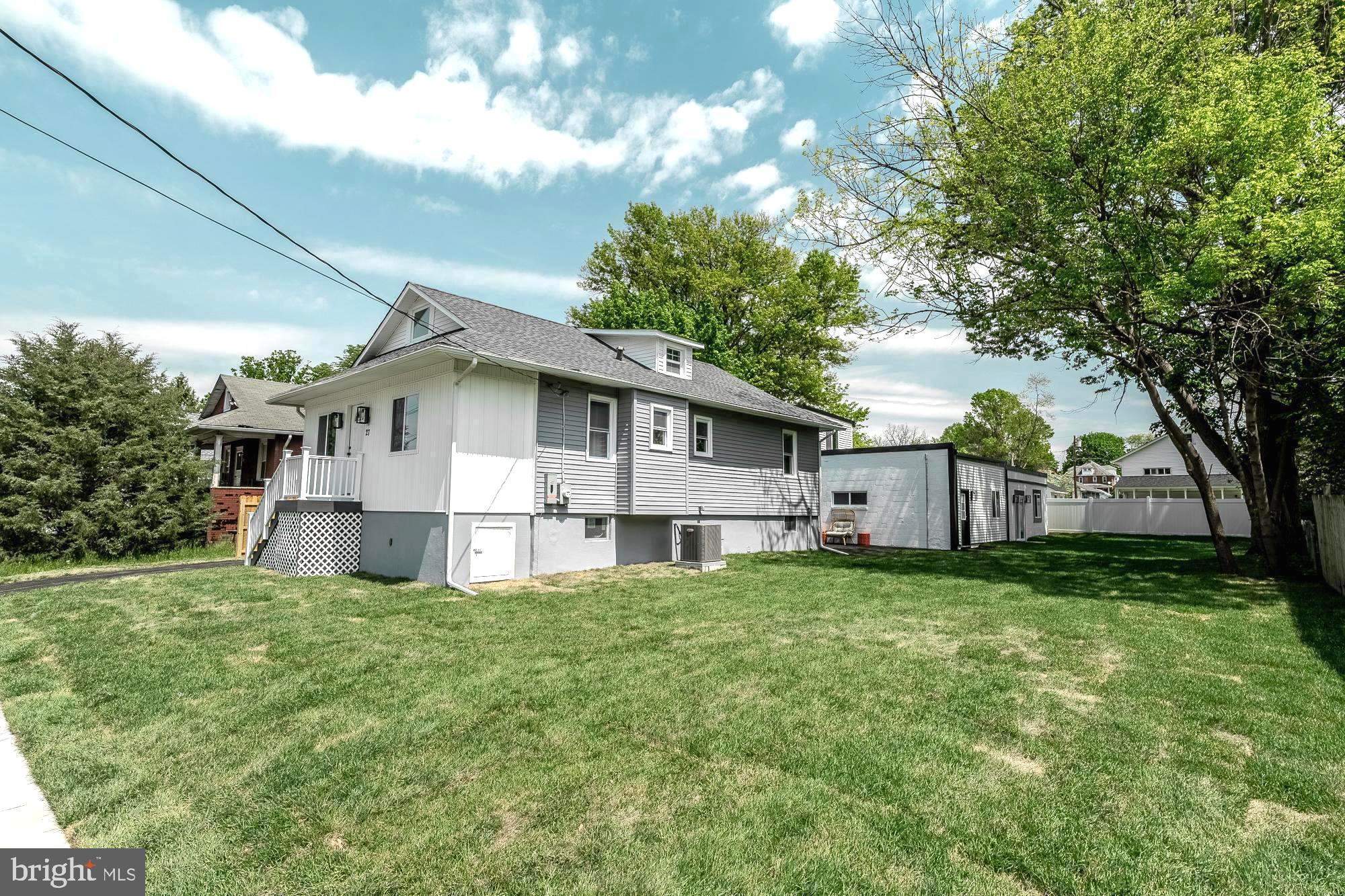 27 Cherry Avenue Maple Shade, NJ 08052 - Photo 43 of 50 a white house that has a tree in front of it