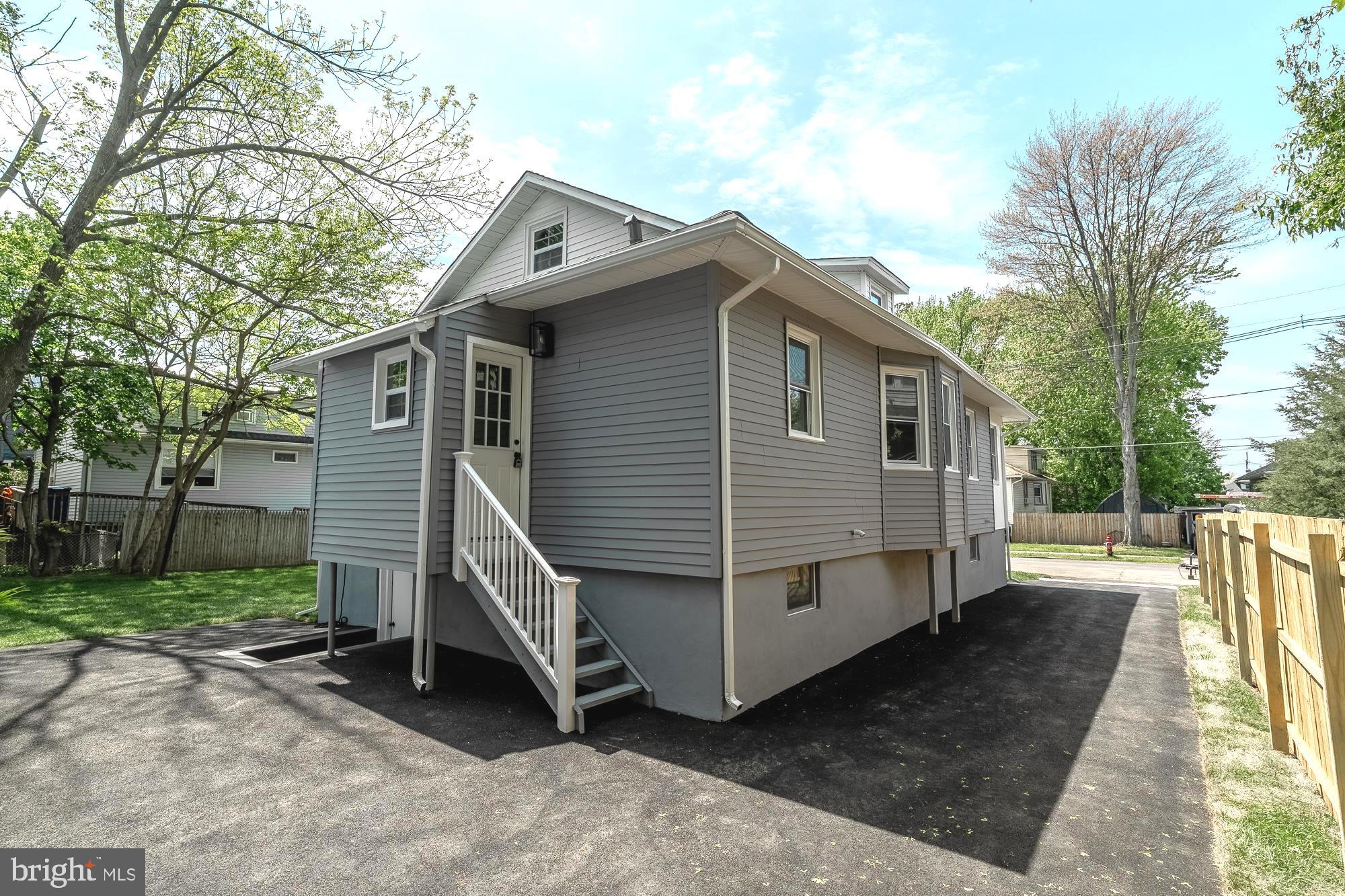 27 Cherry Avenue Maple Shade, NJ 08052 - Photo 44 of 50 a view of a house with a yard chairs and wooden fence