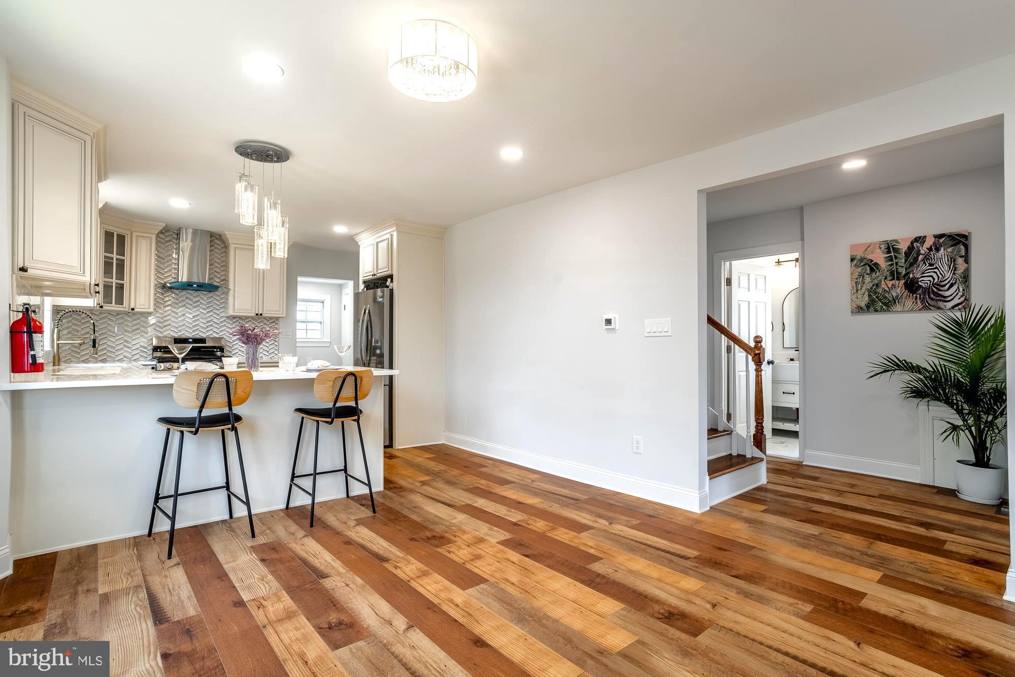 27 Cherry Avenue Maple Shade, NJ 08052 - Photo 9 of 50 a view of a dining room with furniture and a wooden floor