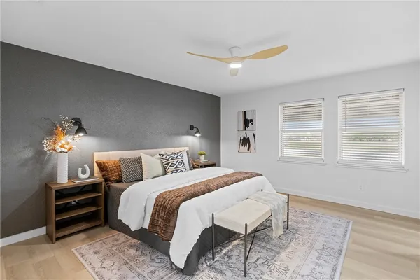 a bedroom with a bed and a window