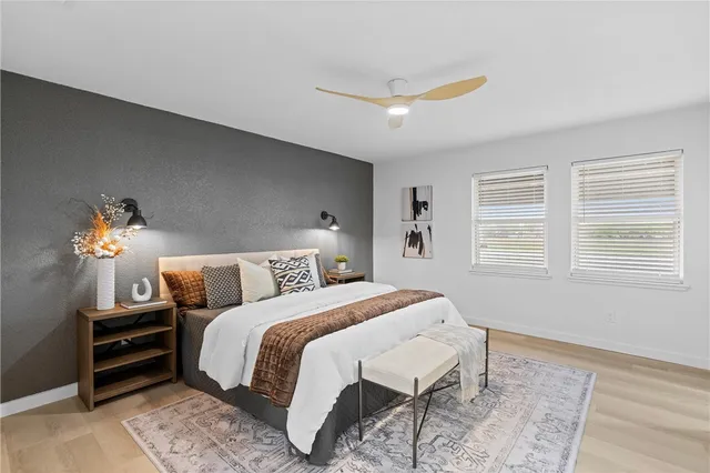 a bedroom with a bed and a window