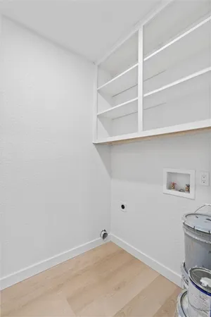 a view of room with racks on the wall