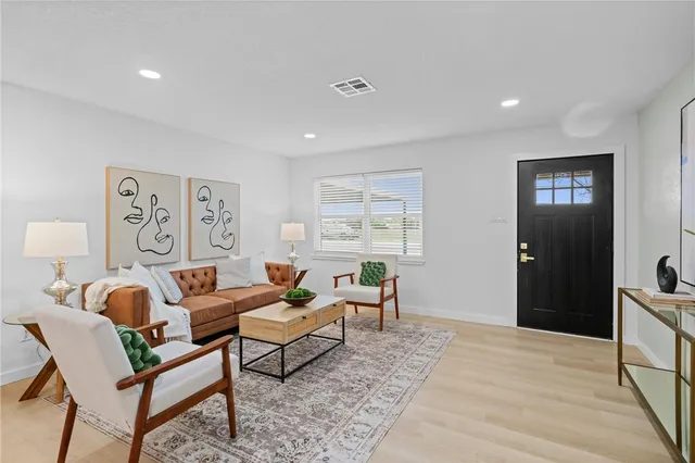 a living room with furniture and a window