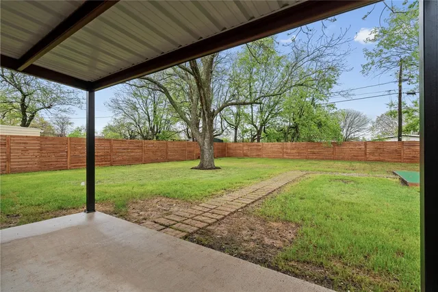 a view of backyard with green space