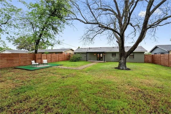 a view of a chairs in a backyard