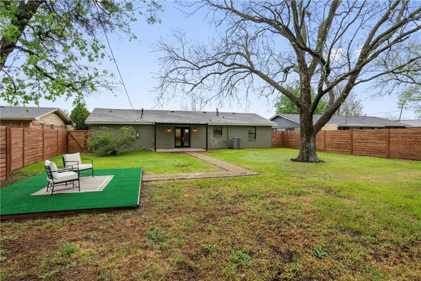 an aerial view of a house with a lake view