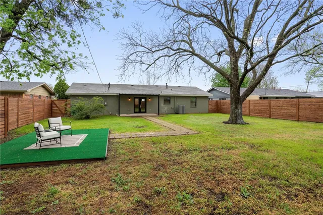 an aerial view of a house with a lake view