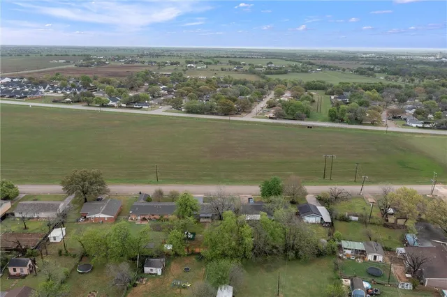 an aerial view of a house with a garden