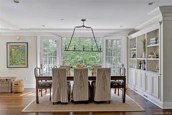 a dining room with furniture window wooden floor