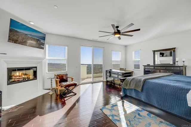 a bedroom with furniture and a flat screen tv