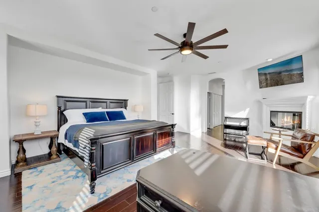 a bedroom with a bed and a table