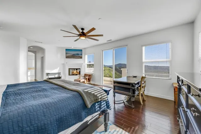 a bathroom with a granite countertop double vanity sink and mirror