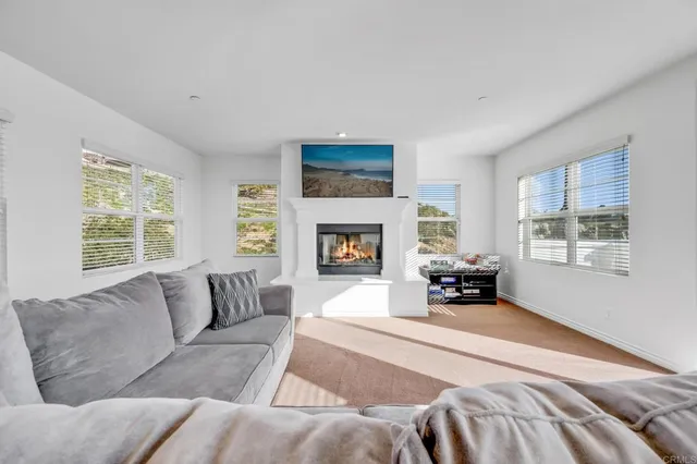a bathroom with a granite countertop toilet sink and mirror