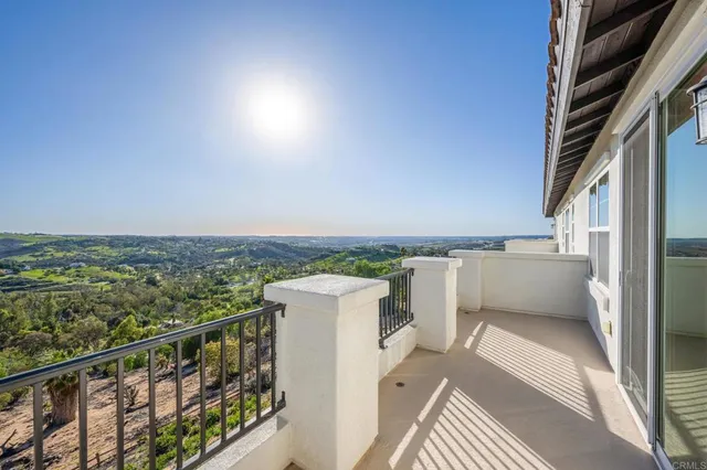 a bedroom with a bed and a tv