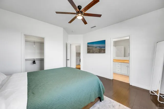 a bathroom with a sink toilet a mirror and shower