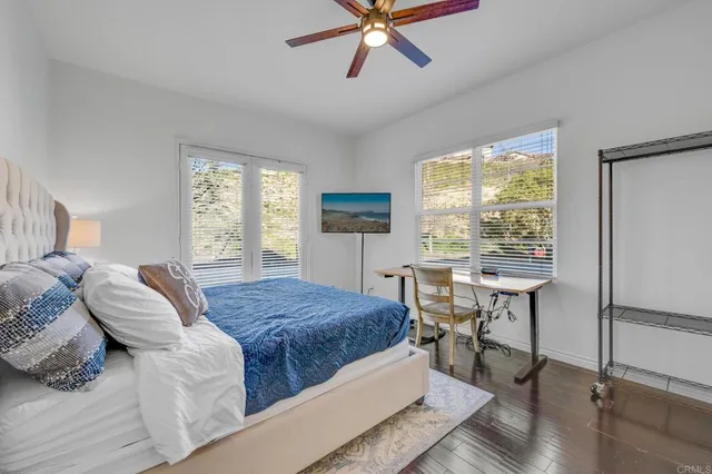 a view of a dining room with furniture and a chandelier