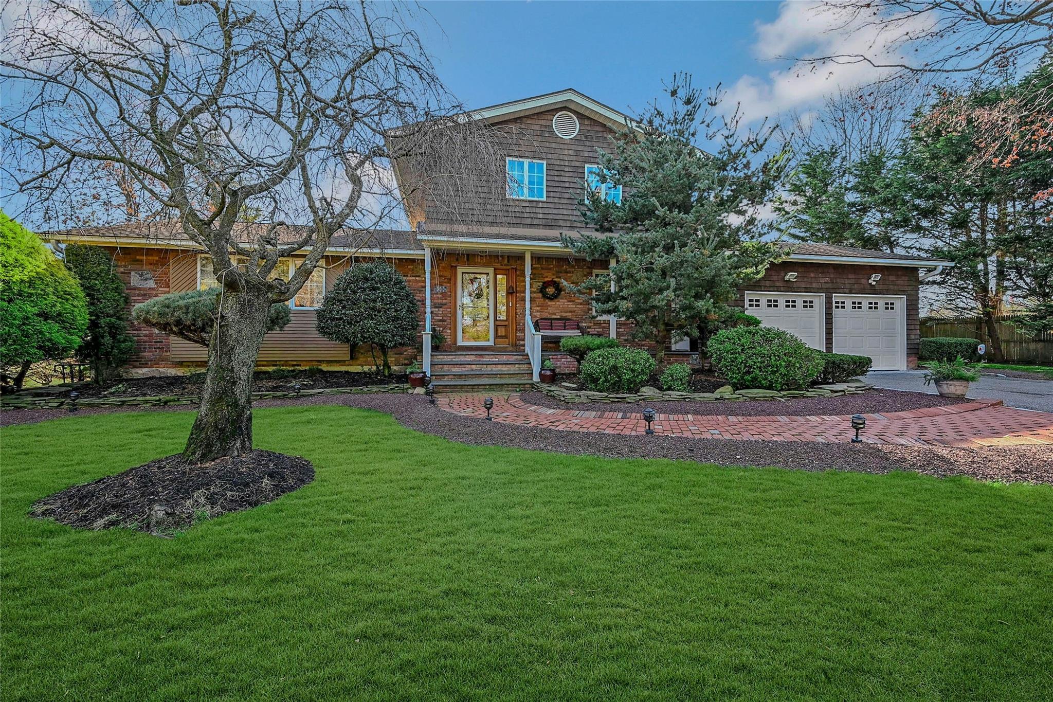 500 Wavecrest Lane Mattituck, NY 11952 - Photo 1 of 1 View of front of house featuring a front yard and a garage