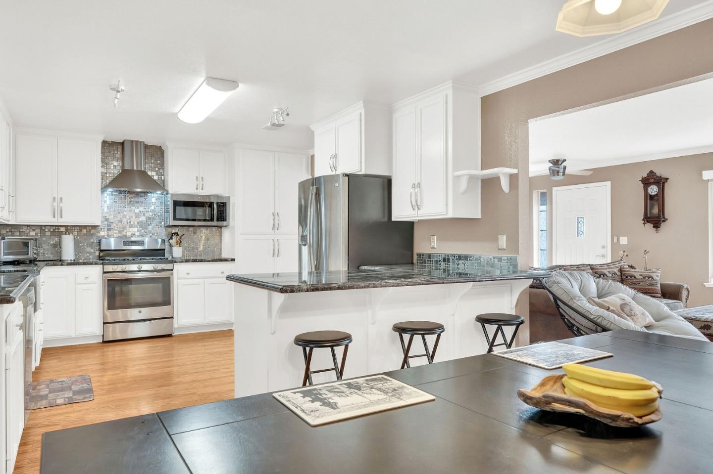 26161 Sugar Pine Drive Pioneer, CA 95666 - Photo 14 of 57 a kitchen with stainless steel appliances granite countertop a sink refrigerator and cabinets