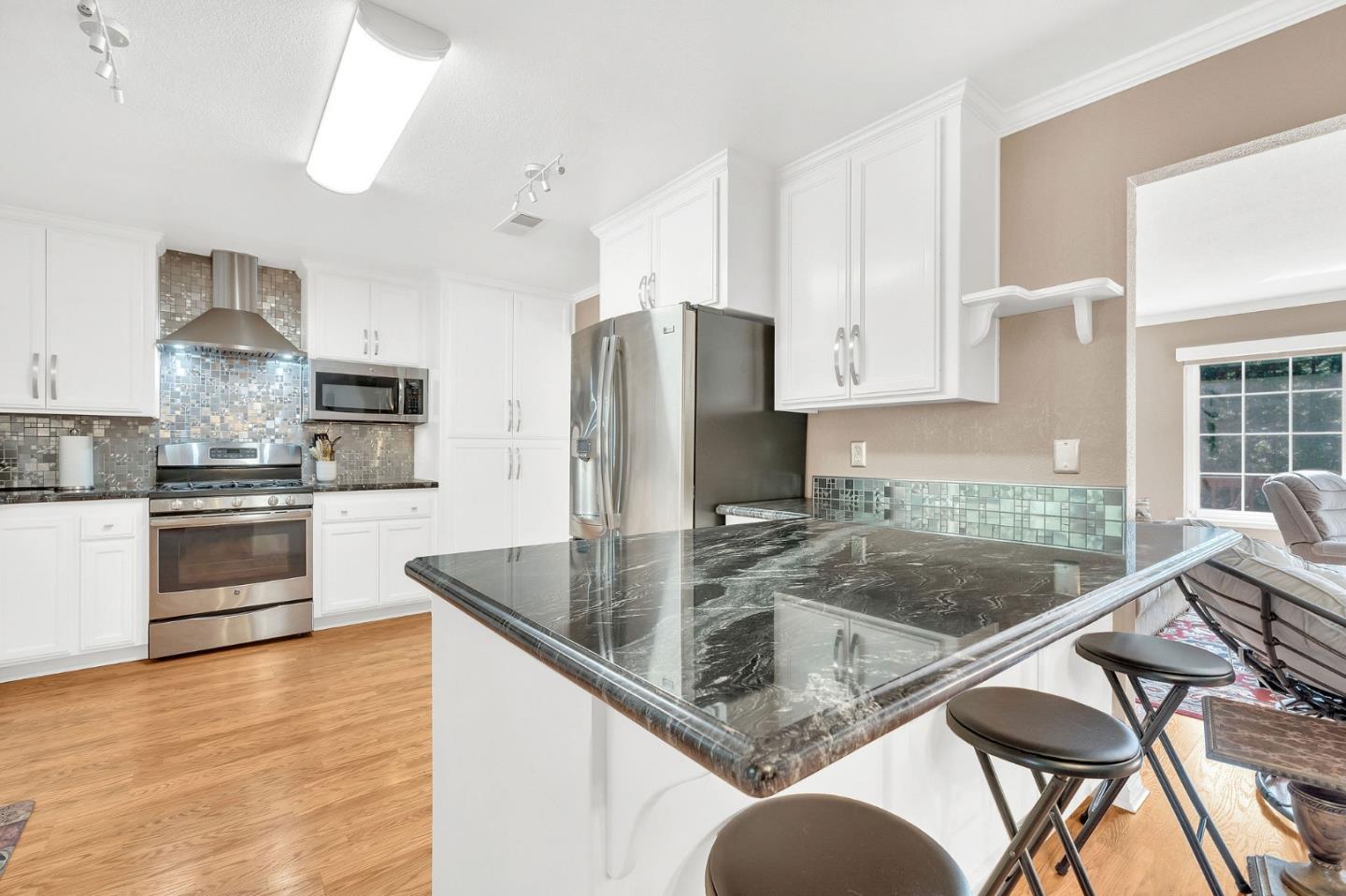 26161 Sugar Pine Drive Pioneer, CA 95666 - Photo 17 of 57 a kitchen with stainless steel appliances granite countertop a sink refrigerator and cabinets