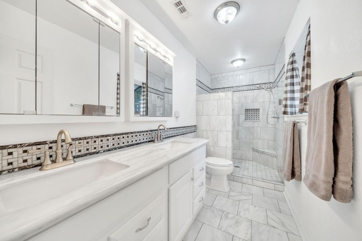 26161 Sugar Pine Drive Pioneer, CA 95666 - Photo 34 of 57 a bathroom with a double vanity sink a toilet and a shower