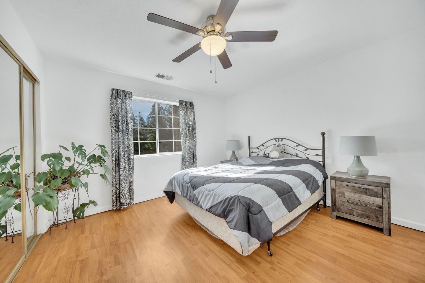 26161 Sugar Pine Drive Pioneer, CA 95666 - Photo 38 of 57 a bedroom with a large bed and a potted plant