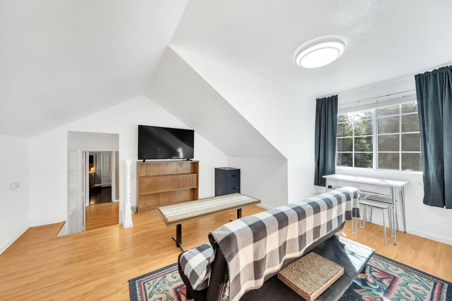 26161 Sugar Pine Drive Pioneer, CA 95666 - Photo 45 of 57 a living room with furniture and a flat screen tv