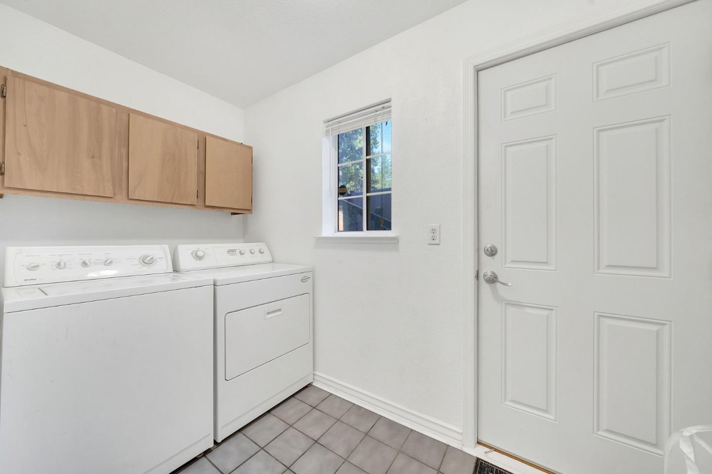 26161 Sugar Pine Drive Pioneer, CA 95666 - Photo 52 of 57 a utility room with cabinets washer and dryer
