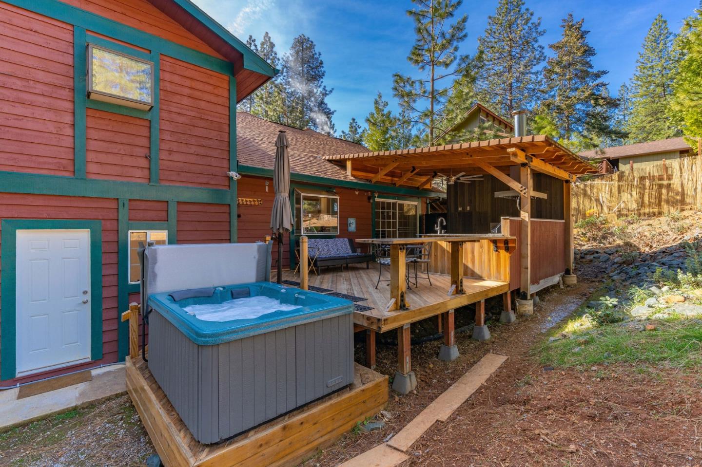 26161 Sugar Pine Drive Pioneer, CA 95666 - Photo 54 of 57 a view of house with a chairs and table in a patio