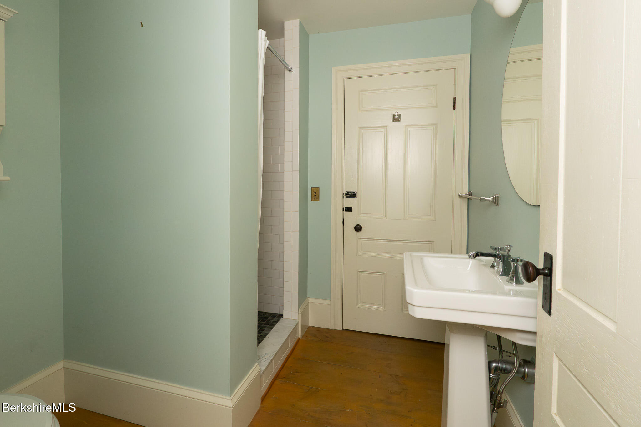 560 Stockbridge Road Lee, MA 01238 - Photo 20 of 48 a bathroom with a sink a mirror and a bathtub