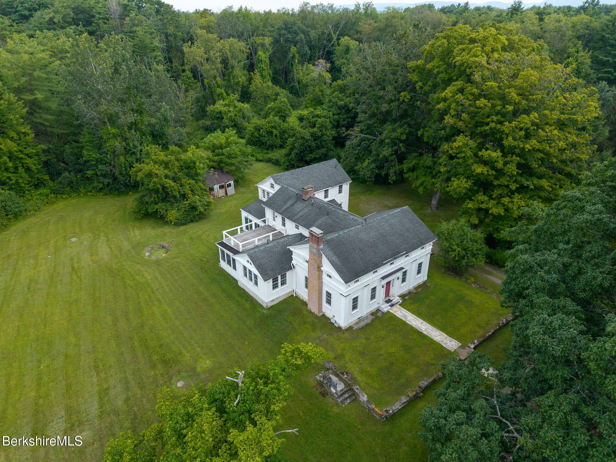 560 Stockbridge Road Lee, MA 01238 - Photo 2 of 48 a view of a house with a yard