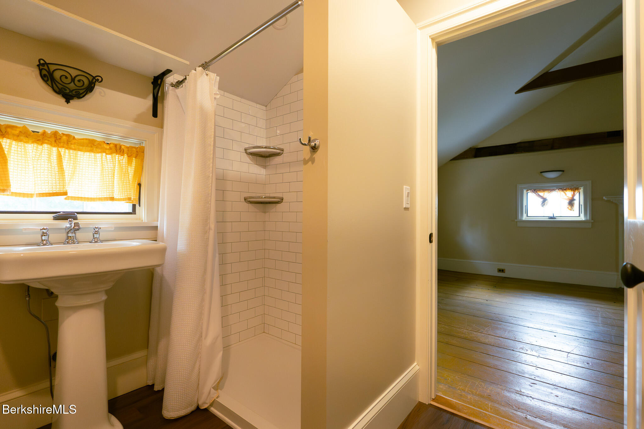 560 Stockbridge Road Lee, MA 01238 - Photo 27 of 48 a view of an empty room with wooden floor and a window