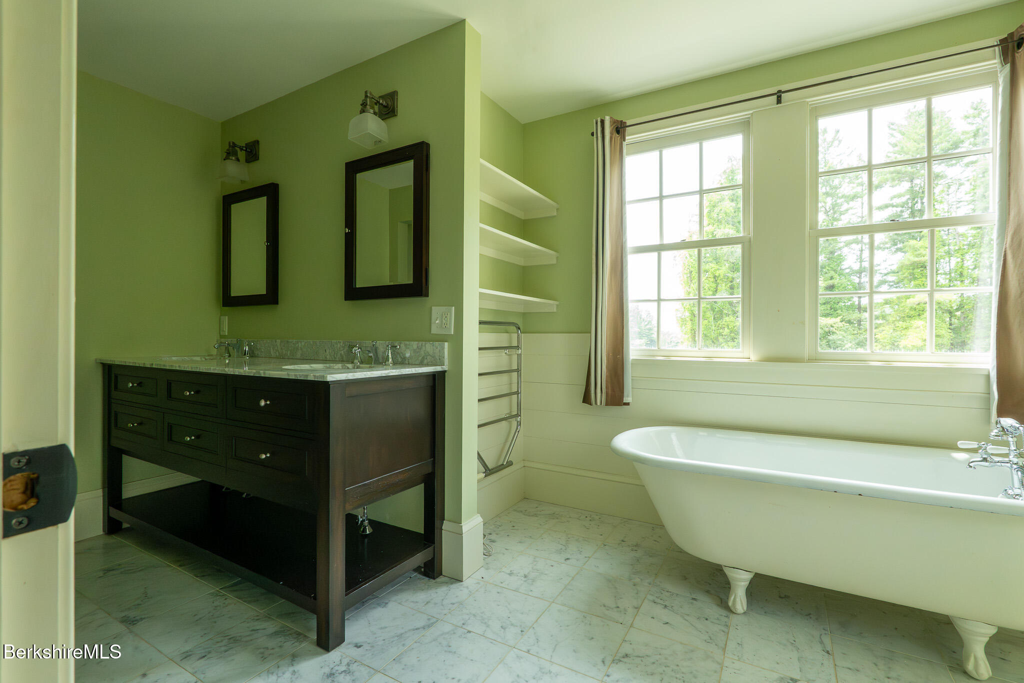 560 Stockbridge Road Lee, MA 01238 - Photo 32 of 48 a bathroom with a bathtub a double vanity sink and a large mirror