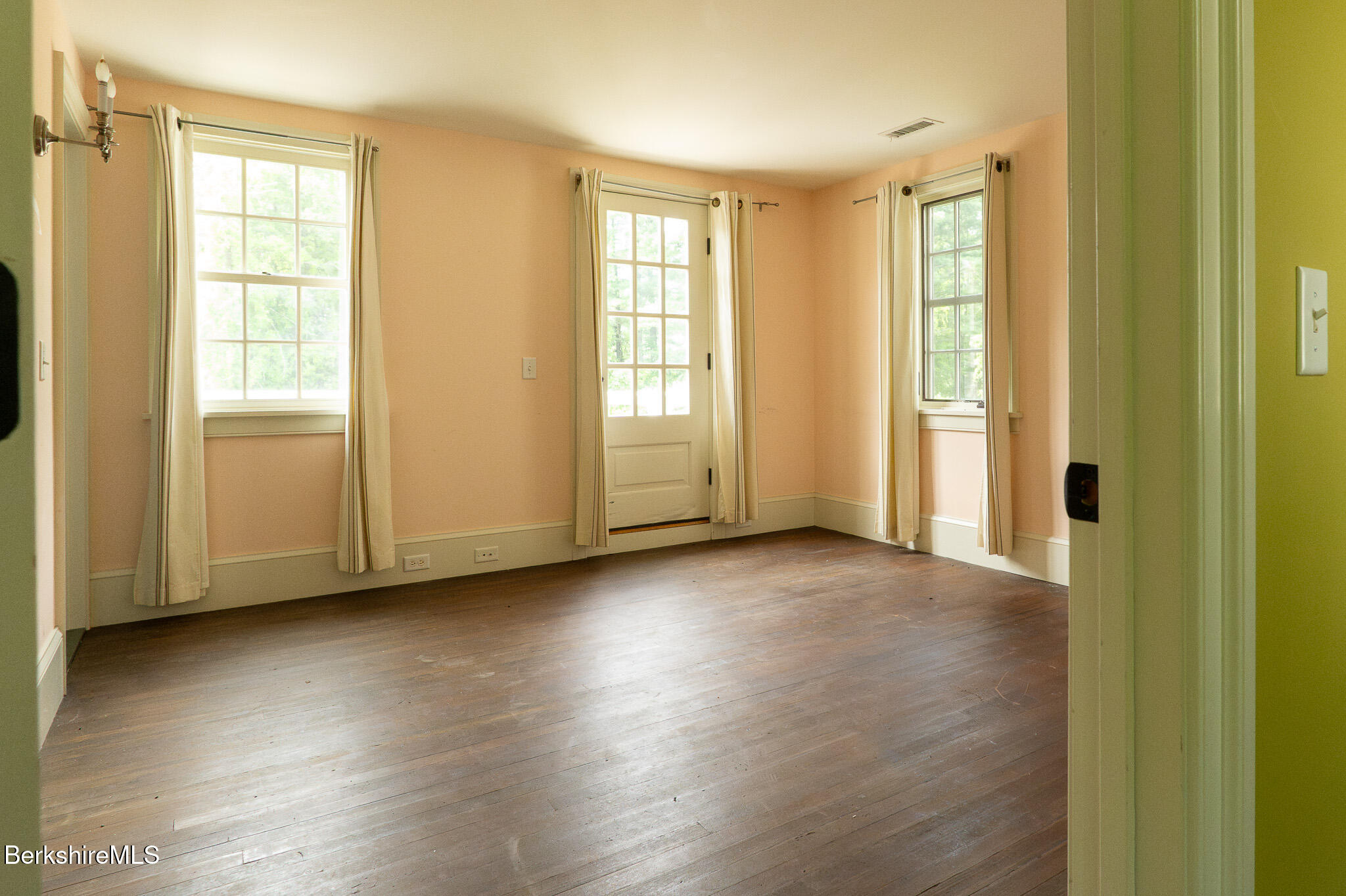 560 Stockbridge Road Lee, MA 01238 - Photo 34 of 48 a view of an empty room with wooden floor and a window