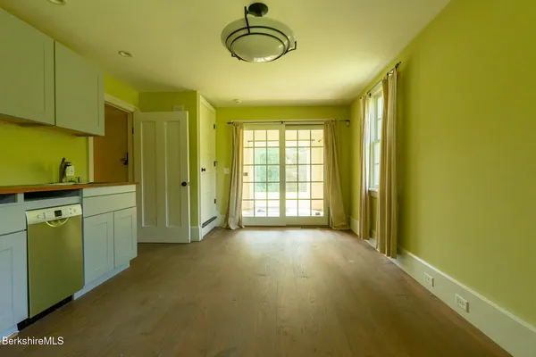a view of a room with window and cabinet