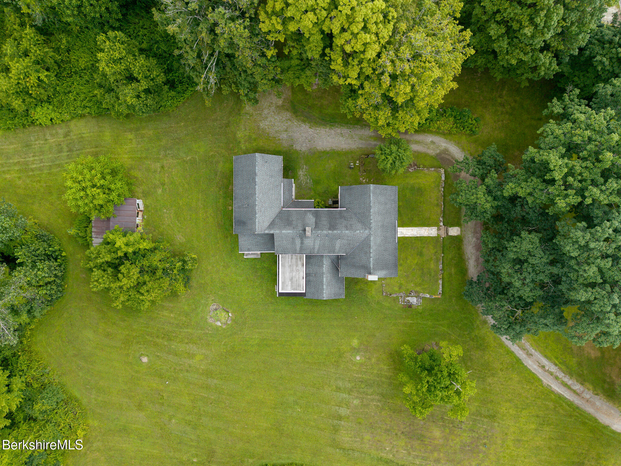 560 Stockbridge Road Lee, MA 01238 - Photo 46 of 48 a view of a house with a yard