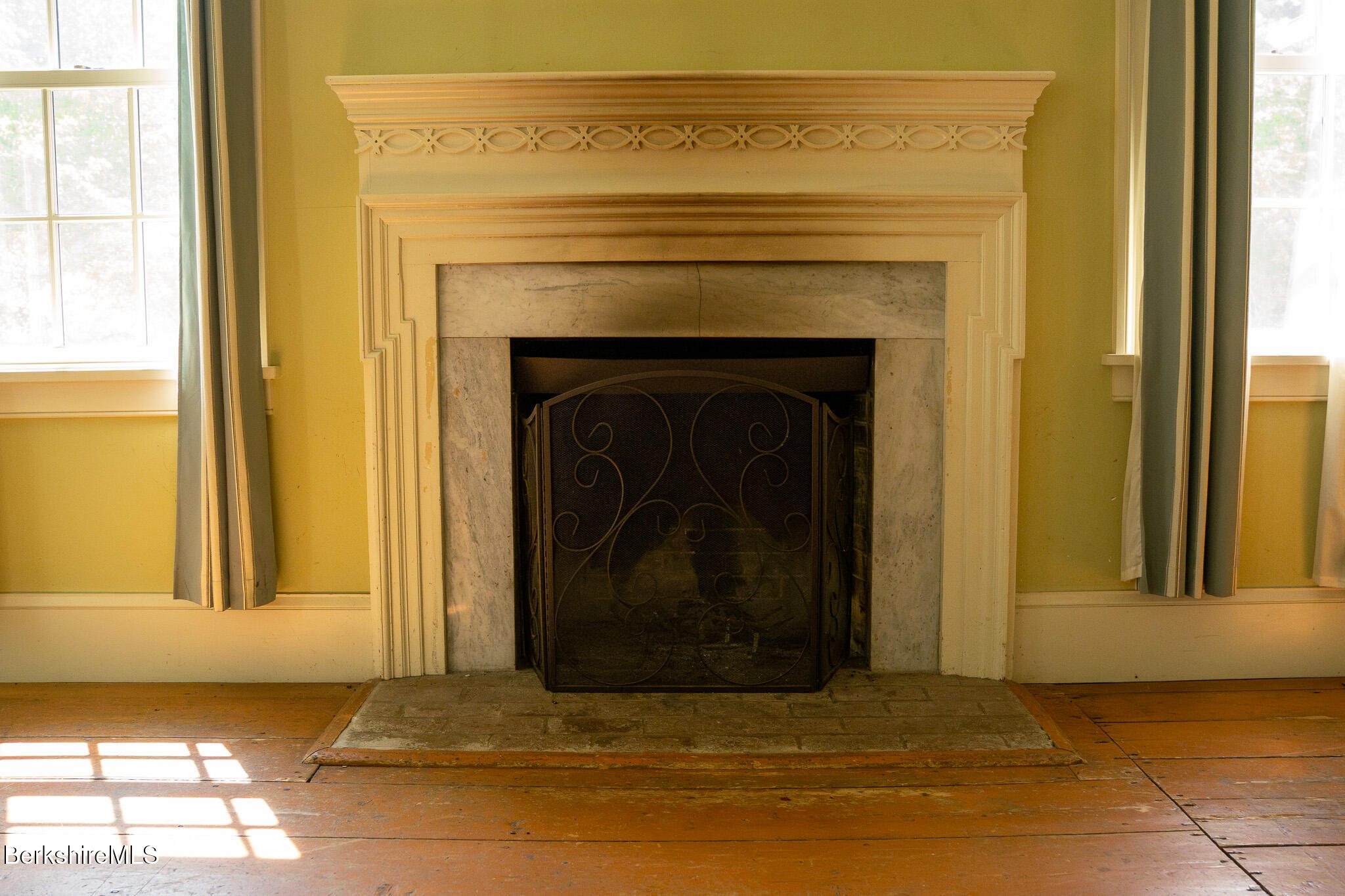 560 Stockbridge Road Lee, MA 01238 - Photo 6 of 48 a view of a livingroom with a fireplace and a window