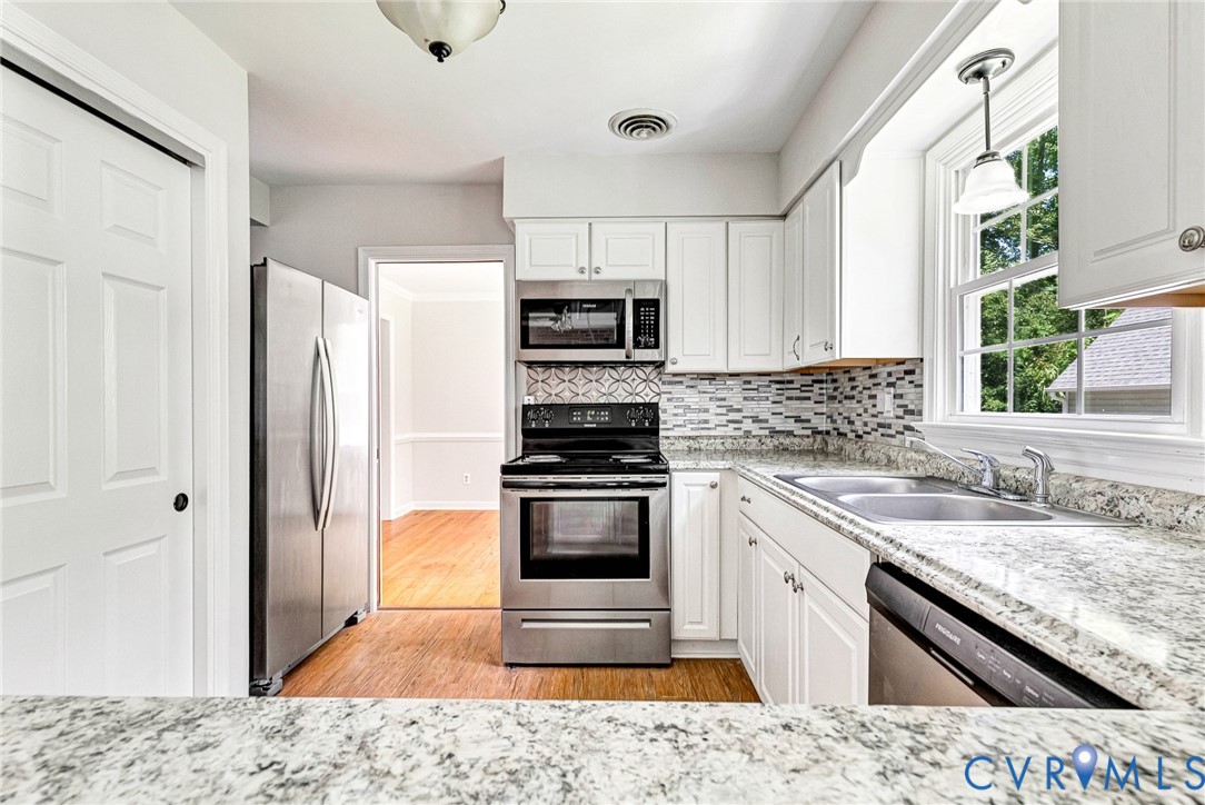 10478 Gould Hill Road Hanover, VA 23069 - Photo 8 of 63 Updated kitchen featuring white cabinetry, granite