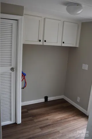 a view of cabinets and wooden floor