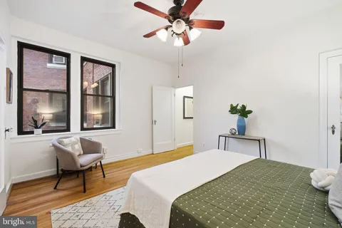 a bedroom with a bed and window