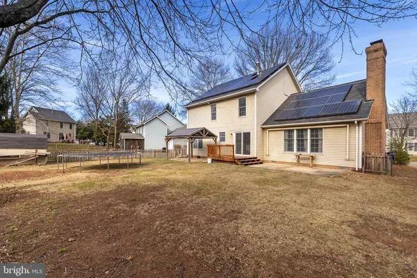 a view of a house with a yard and garage