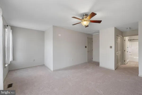 a view of a livingroom with a ceiling fan