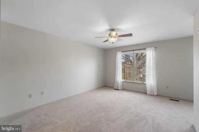 an empty room with a empty space and a window