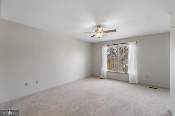 an empty room with a empty space and a window